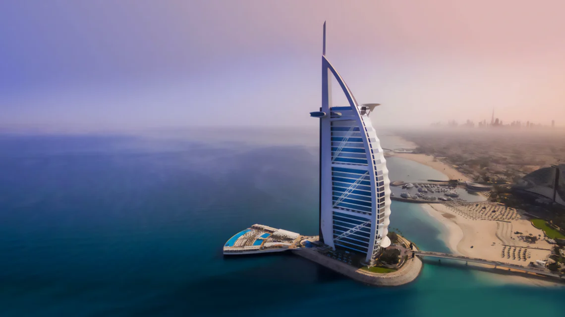 Aerial view of Jumeirah Burj Al Arab, the iconic luxury hotel in Dubai, surrounded by the Arabian Gulf